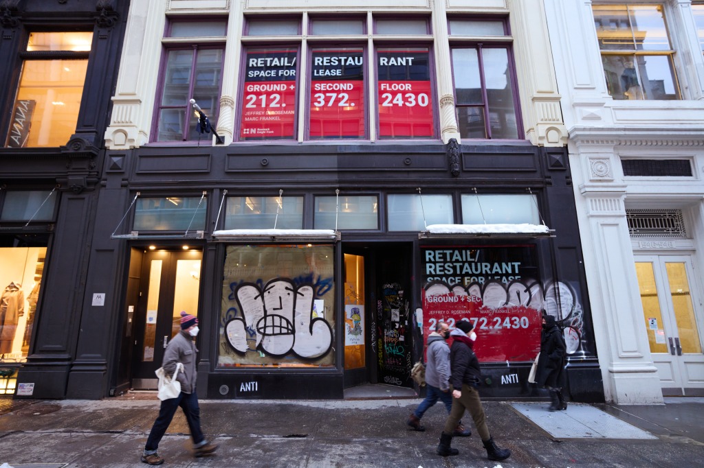 Signs advertises the availability of retail space.